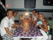 Playing cards outside the trailer.