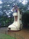 A big shoe house. I don't thinkthere is a story, it's just cool.
