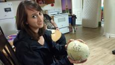 Rachel modelling my birthday cantelloupe