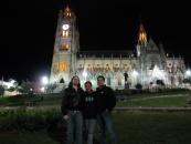 Xime with the guys in front of a gothic church